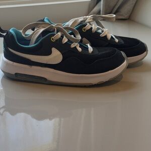Nike Kids Black Sneakers with White Swoosh and Teal Lining